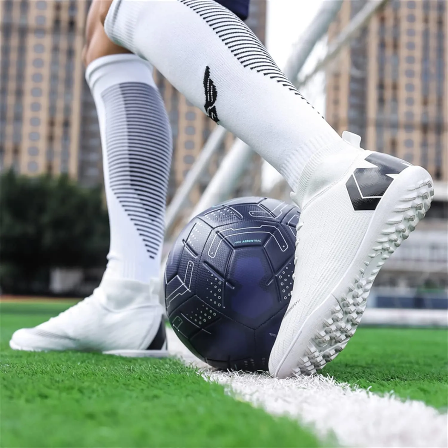 Unisex soccer sneakers are light, breathable, non-slip and shock-absorbing, and The youth high-top indoor lawn training hard bottom TF/AG.