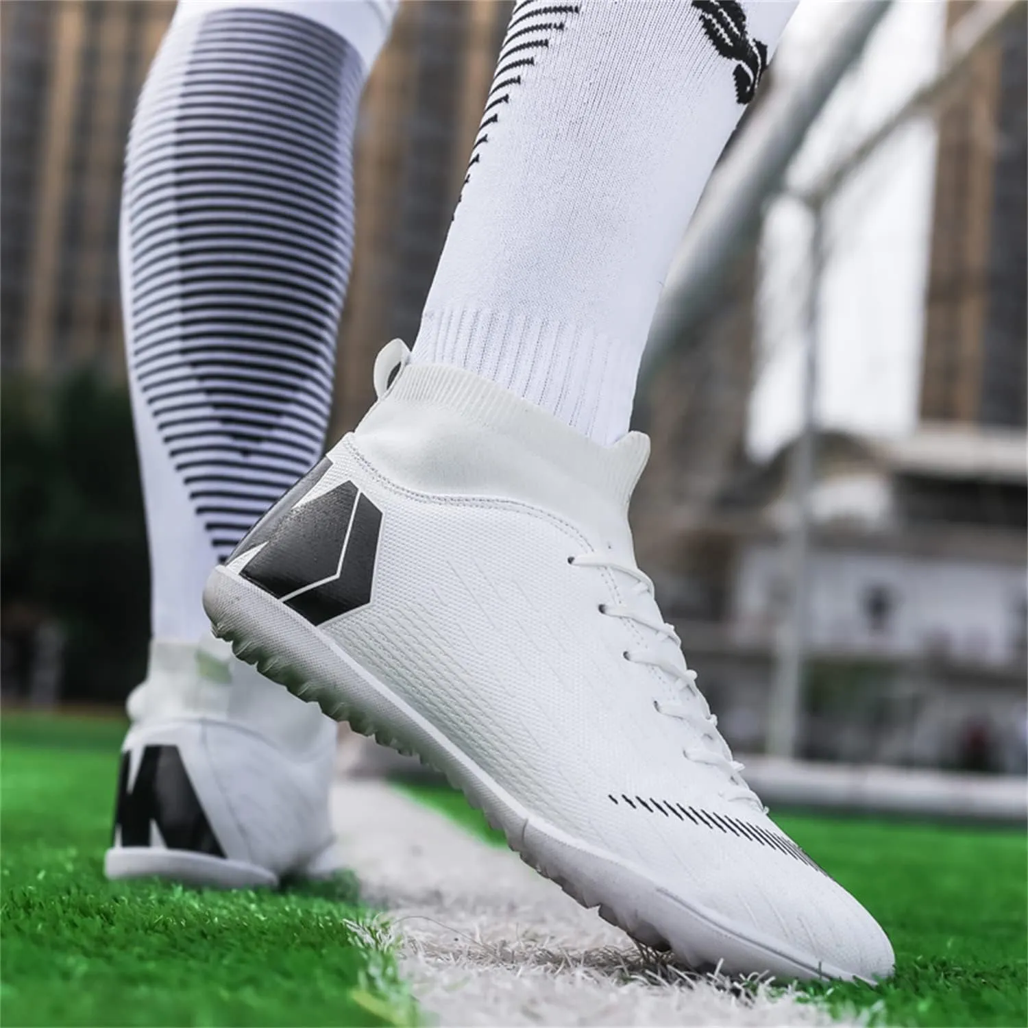 Unisex soccer sneakers are light, breathable, non-slip and shock-absorbing, and The youth high-top indoor lawn training hard bottom TF/AG.